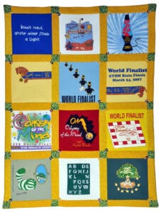 Odyssey of the Mind Quilt, 2011 | Maker: Jody Bishop Pullan, American, Norwalk, CT | Machine Stitched, patchwork with t-shirt logos and yellow cotton borders, 57” x 42¼” | Loaned by Jody Bishop Pullan